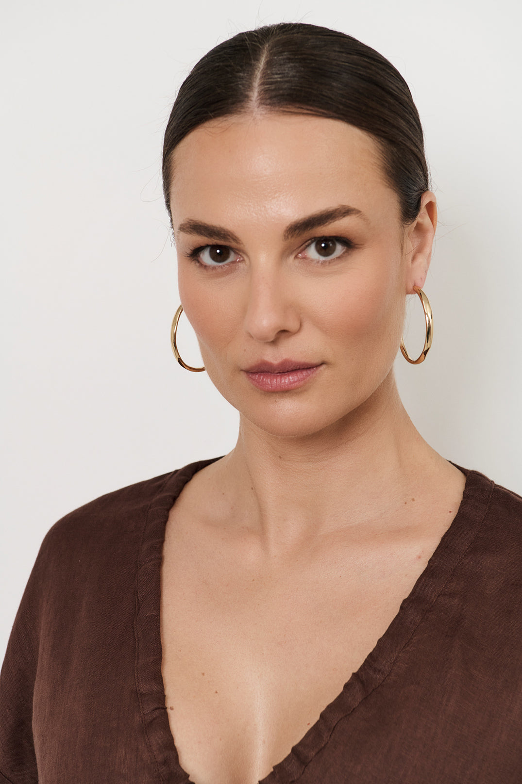 Mid Size Organic Shape Hoop Earrings in gold – front view, nickel free organic shaped hoops | Sonella