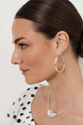 Mid Size Organic Shape Hoop Earrings in silver – styled view showing organic hoop silhouette, nickel free | Sonella